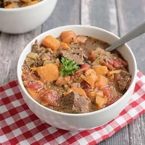 beef stew in a bowl on a table 