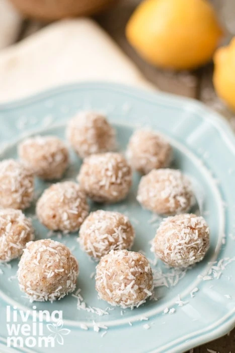 Overhead view of lemon coconut energy balls on a blue plate