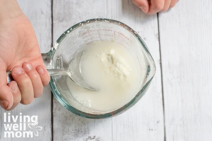 Stirring ingredients to make sidewalk chalk