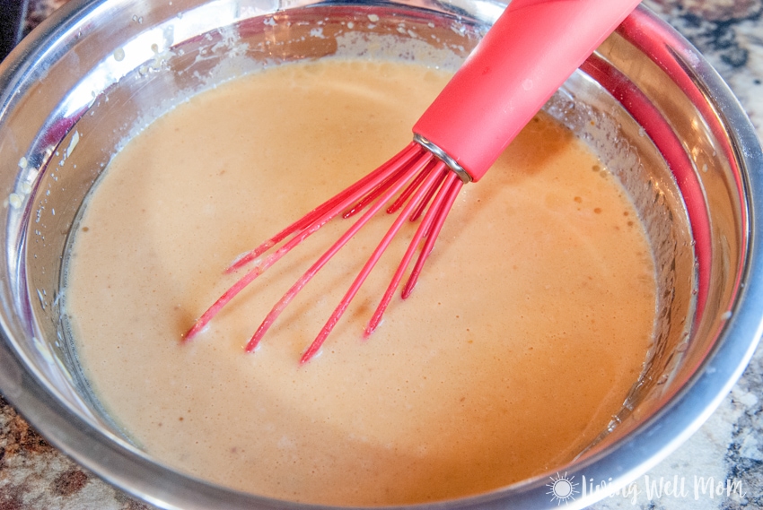 whisking batter in a bowl