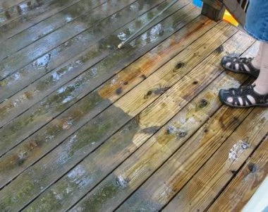 a dirty deck being cleaned