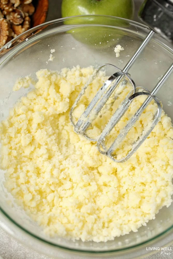 Shortening and sugar mixed together in a glass bowl. 