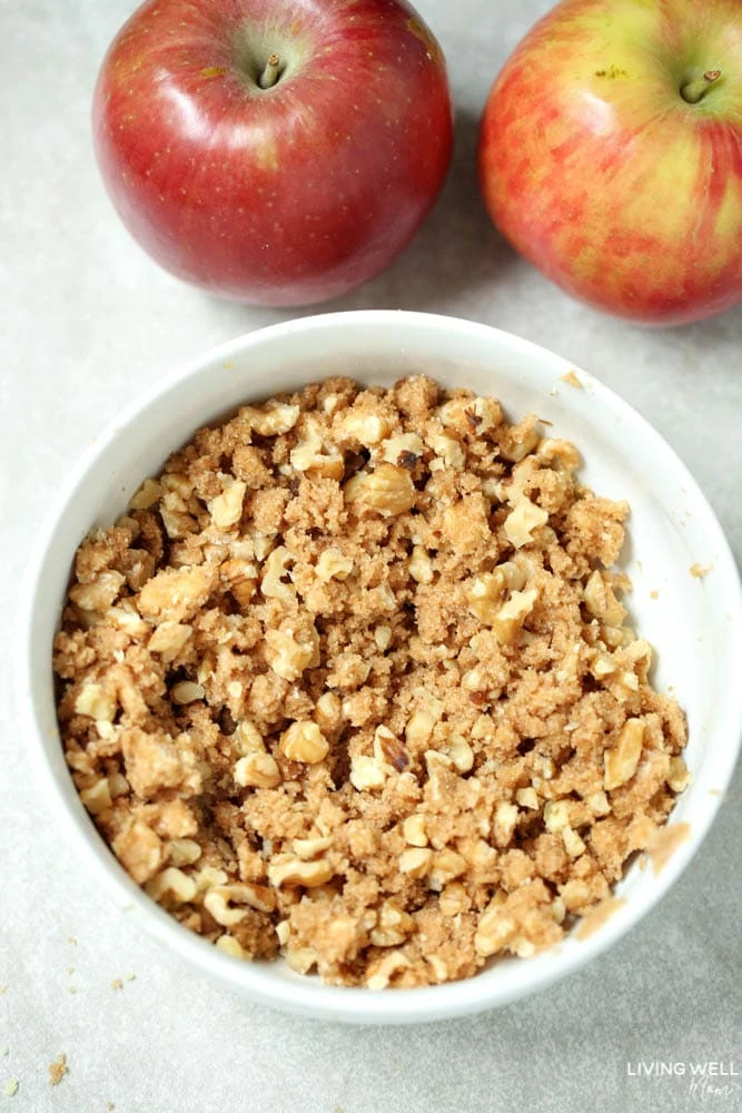 Walnuts, brown sugar, cinnamon and butter crumbled up in a small bowl.