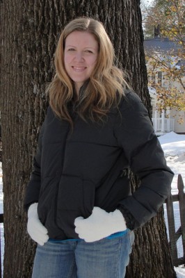 woman wearing a plain black winter coat with no hood