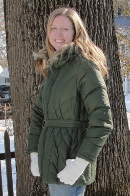 woman wearing green winter coat with fuzzy hood