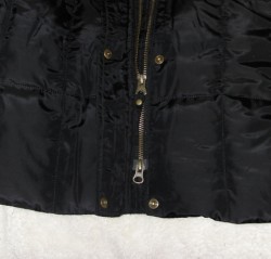 zipper of black winter coat