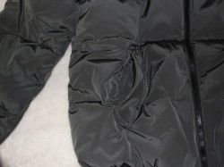 zipper of plain black winter coat 