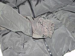 a sleeve of a plain back winter coat