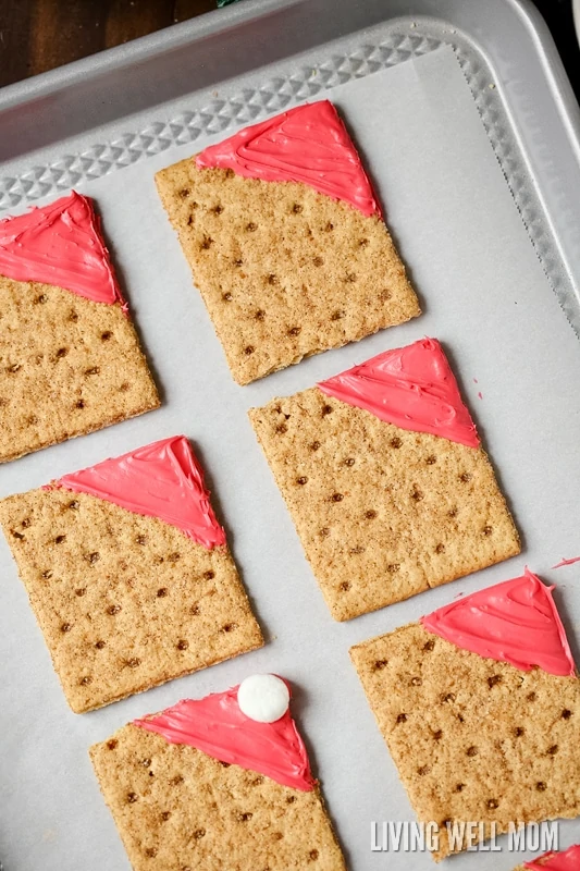 square gram crackers with red frosting on it