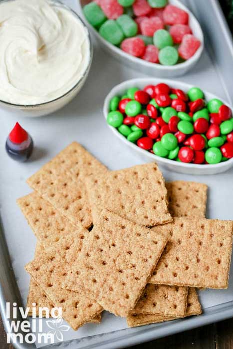 graham crackers, m&m's and icing for making Christmas cookies