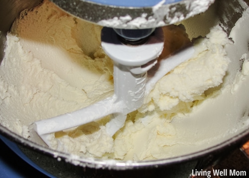 milk being added to the frosting 