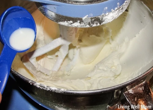 more milk being added to the frosting 