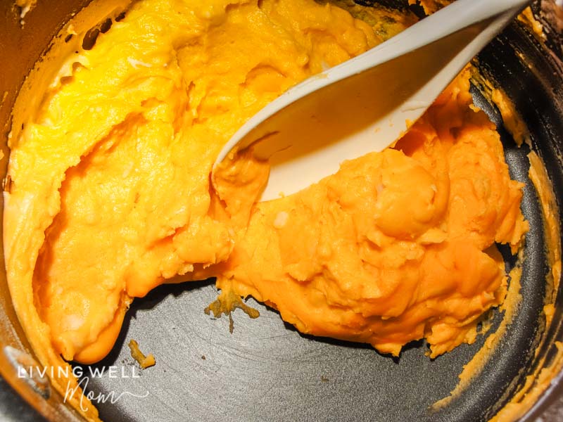 DIY playdough batter being stirred on the stovetop.