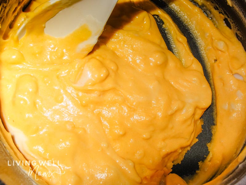 Orange food coloring added into playdough batter while cooking on the stove. 
