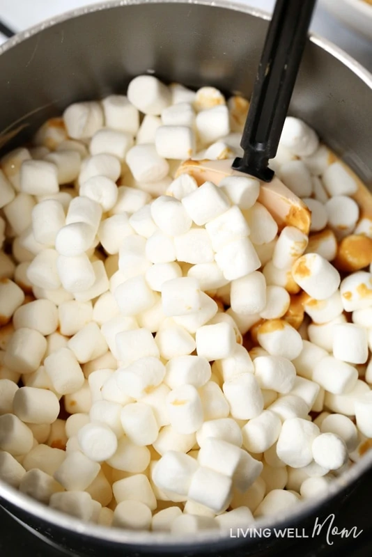 stirring marshmallows and peanut butter