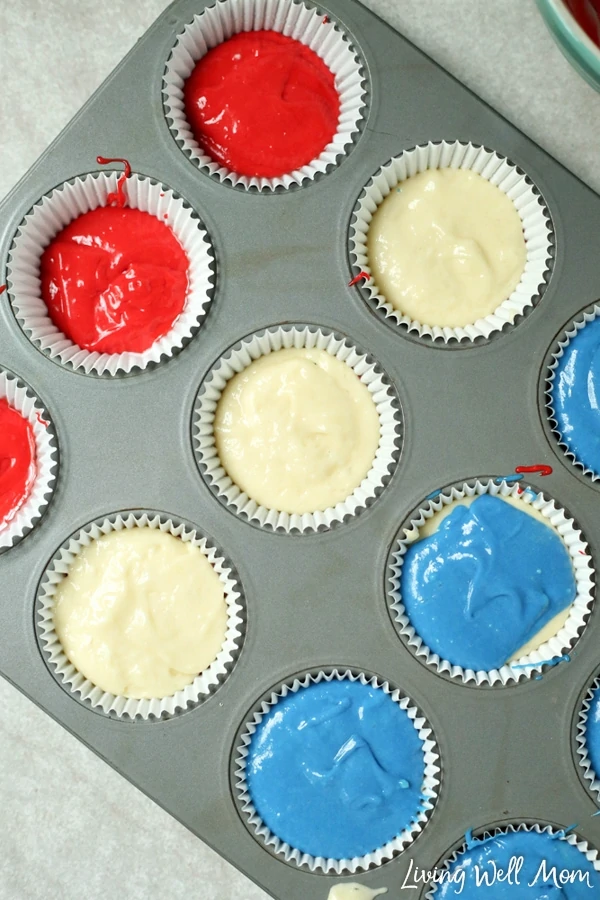 red white blue cupcake batter in muffin tin