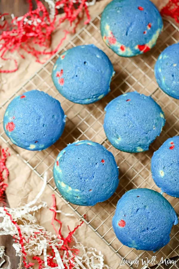 blue cupcakes cooling on wire rack