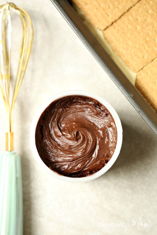 chocolate frosting with a whisk