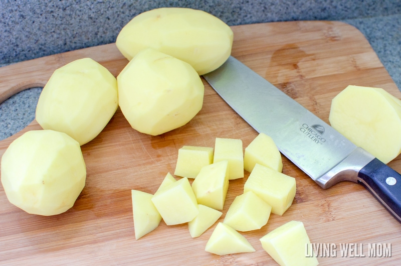 chopping peeled potatoes