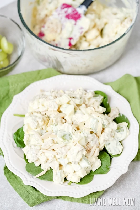 This delicious Almond Chicken Salad has slivered almonds, grapes, celery, and hard-boiled eggs tossed with cooked chicken and combined with mayo, sour cream, and seasoning. It's perfect for a delicious lunch or even enjoyed as supper on a hot summer day.