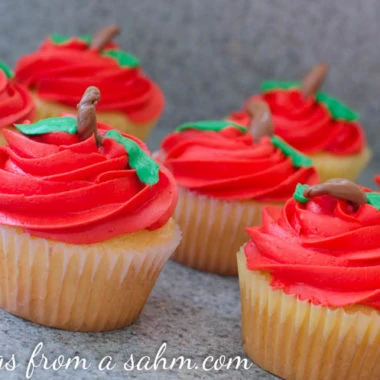 a close up of cupcakes that look like apples