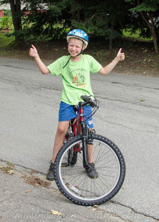 A young boy riding a bicycle