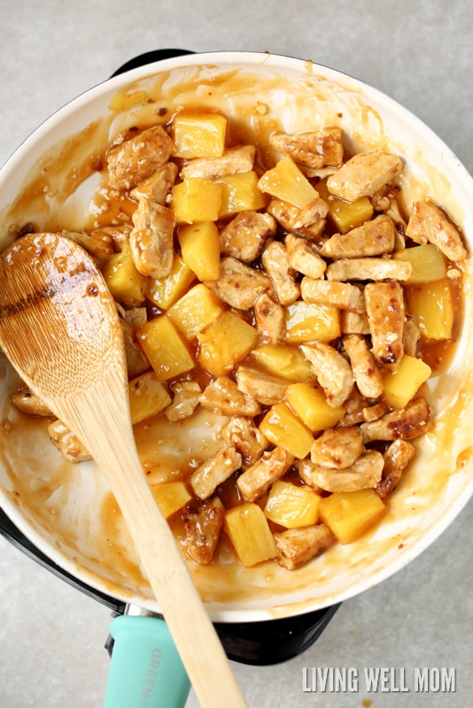 stirring aloha chicken in a skillet