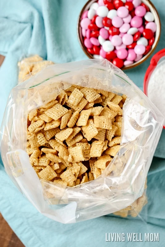 coated chex in a ziplock bag to cover with powdered sugar