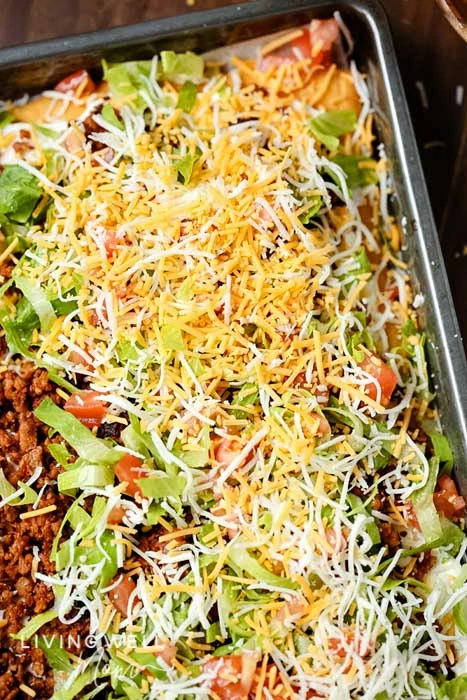 Taco pizza sprinkled with cheese