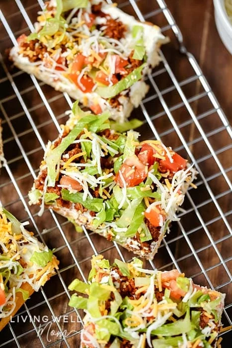 Fresh slices of taco pizza on a cooling rack