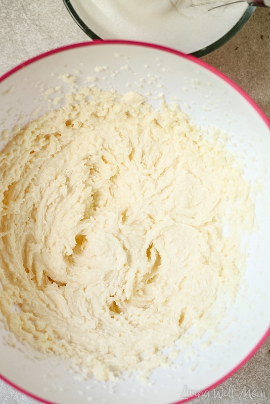 Butter, sugar and vanilla batter in a ceramic bowl. 