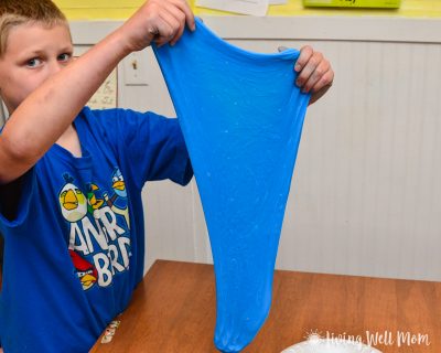 boy holding stretchy blue slime
