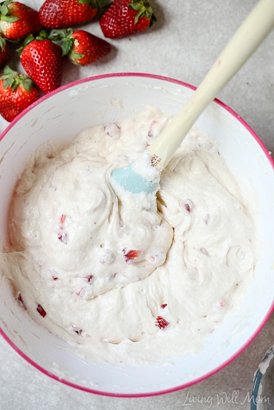 Strawberry cupcake mixture stirred smoothly together in a bowl.