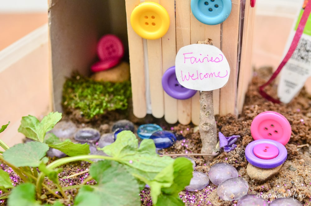 Cute DIY fairy house with decorative stones. 