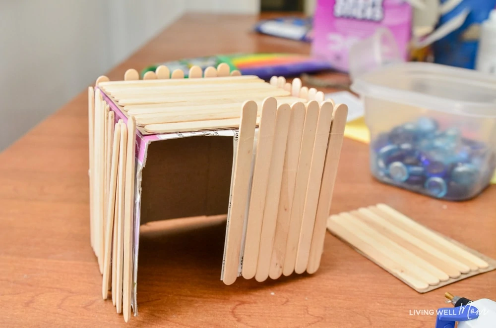 A DIY fairy house craft using popsiscle sticks.