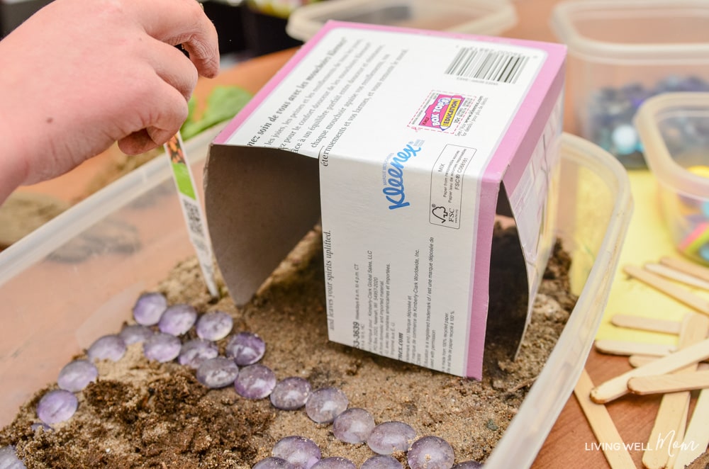 A kleenex box being recycled into a fairy house DIY. 