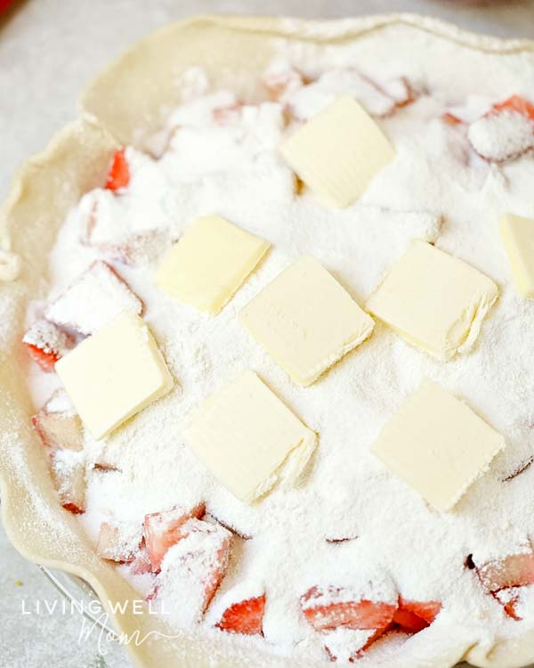 strawberry rhubarb pie filling with sugar and butter