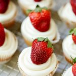 Love cheesecake and strawberries? You’ll be in heaven with this tasty Strawberry Cheesecake Cupcakes recipe! With a graham cracker crust, light cupcake with strawberry chunks, and a cheesecake frosting, this is one delicious strawberry dessert!
