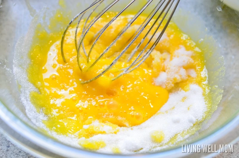 sugar and egg yolks being combined