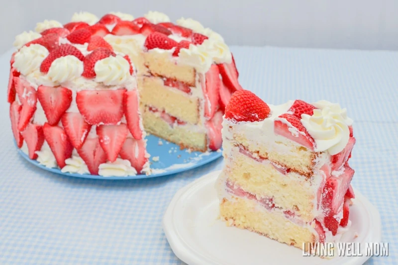 large slide of strawberry layer cake on a small plate
