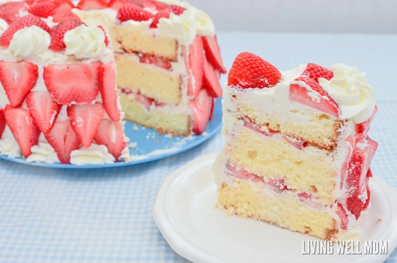 fresh berry cake with a piece cut sitting on a plate