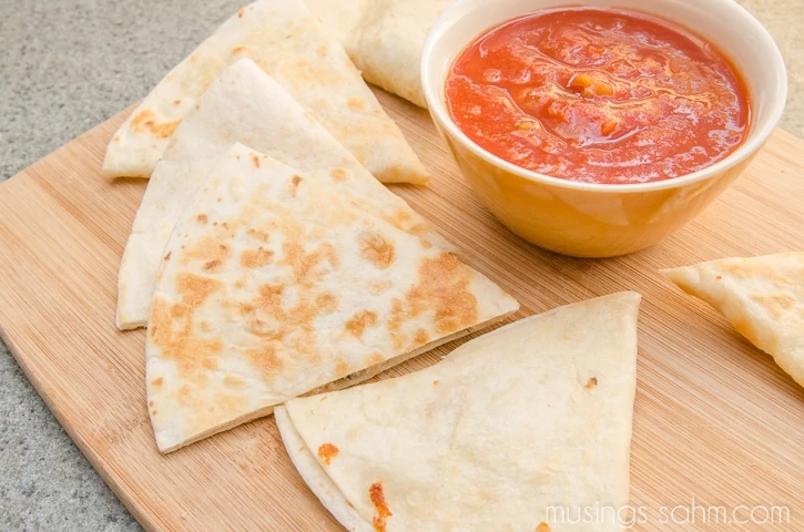 quesadillas with salmon cut into triangles