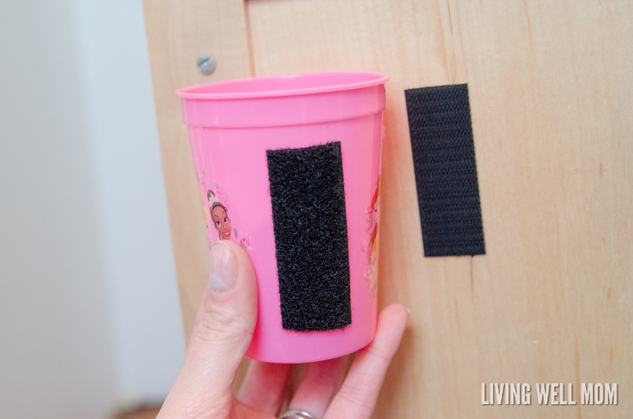 velcro on a cabinet door and plastic cup