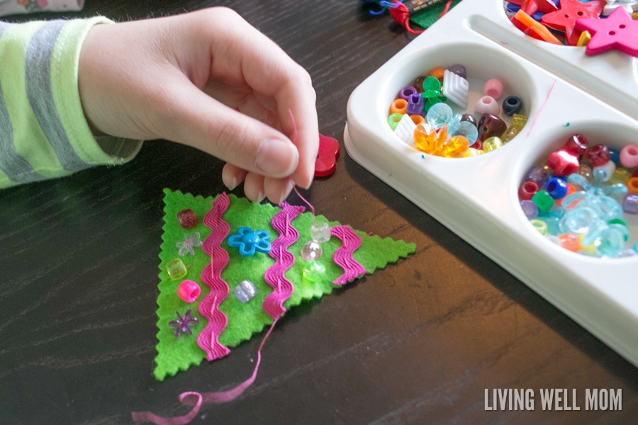 Felt Christmas Tree Ornaments are a perfect first sewing project for kids as young as 4 years. Easy to make, this craft can be customized and enjoyed all the way up to adults!