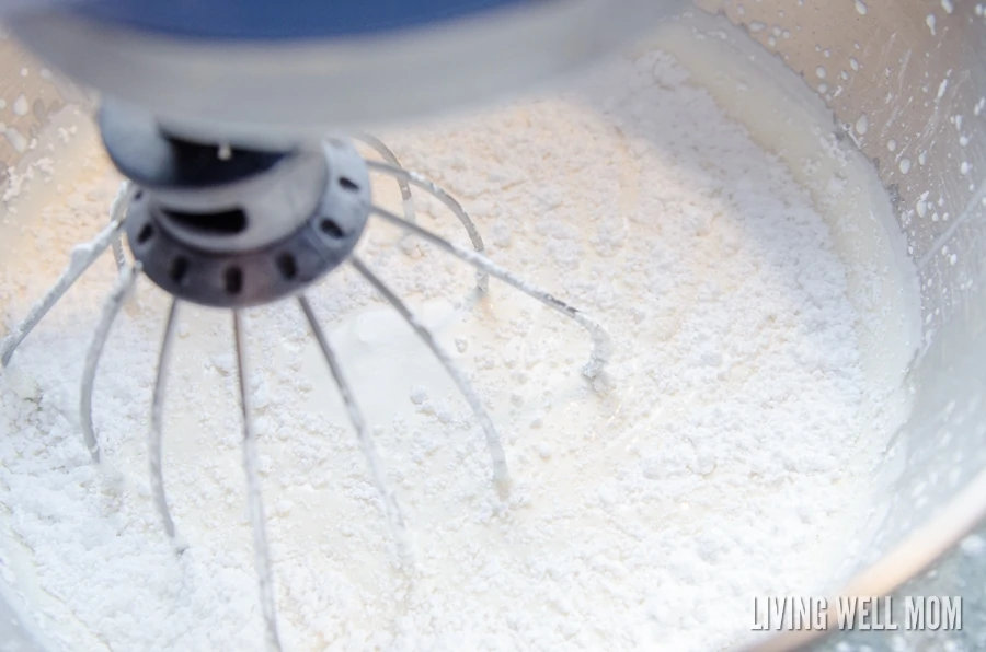 Adding powdered sugar to the whipped cream frosting 