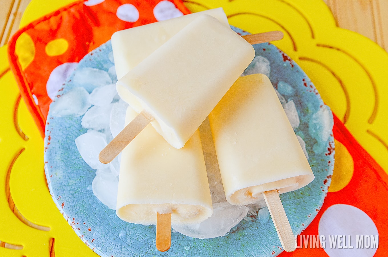 These Orange Yogurt Popsicles are unbelievably easy to make and a satisfying nutritious snack kids of all ages will love. And you’ll love how this simple recipe will fill them up, thanks to the added protein from the yogurt!
