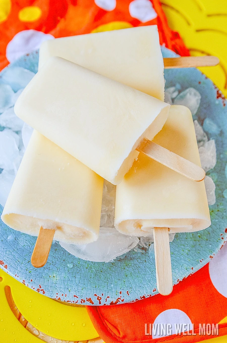 These Orange Yogurt Popsicles are unbelievably easy to make and a satisfying nutritious snack kids of all ages will love. And you’ll love how this simple recipe will fill them up, thanks to the added protein from the yogurt!