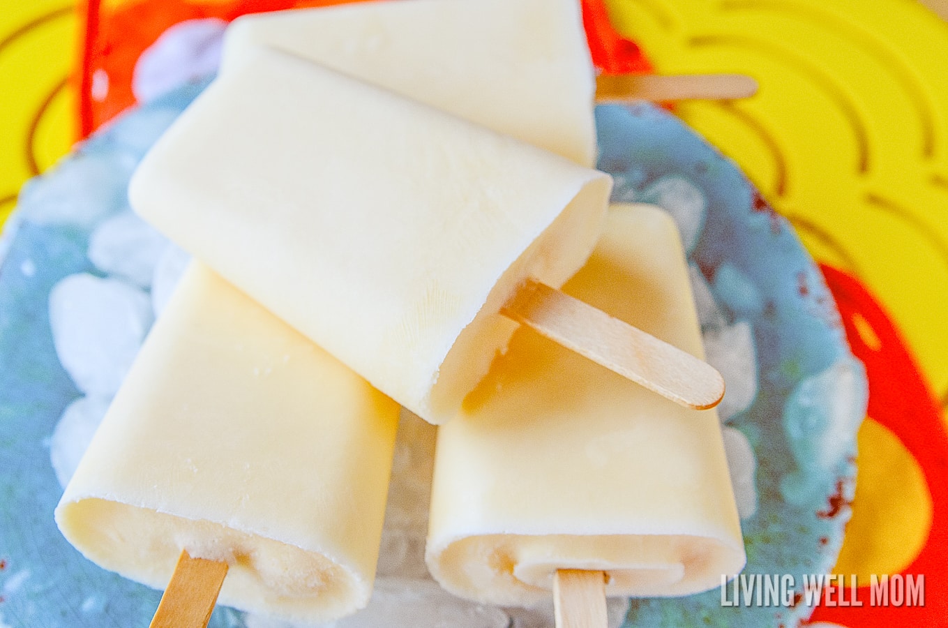 These Orange Yogurt Popsicles are unbelievably easy to make and a satisfying nutritious snack kids of all ages will love. And you’ll love how this simple recipe will fill them up, thanks to the added protein from the yogurt!