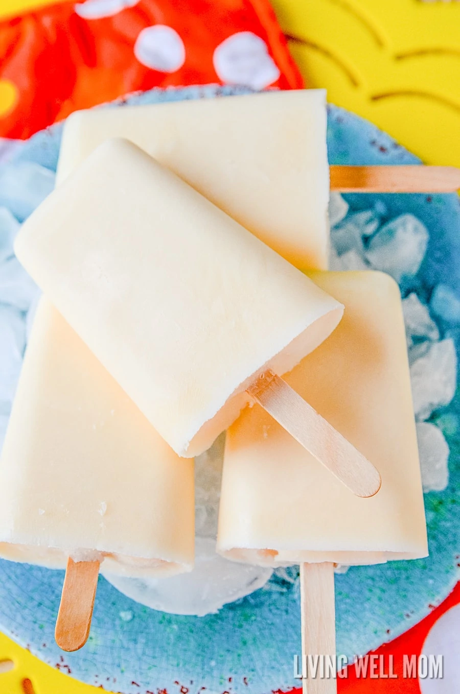 These Orange Yogurt Popsicles are unbelievably easy to make and a satisfying nutritious snack kids of all ages will love. And you’ll love how this simple recipe will fill them up, thanks to the added protein from the yogurt!