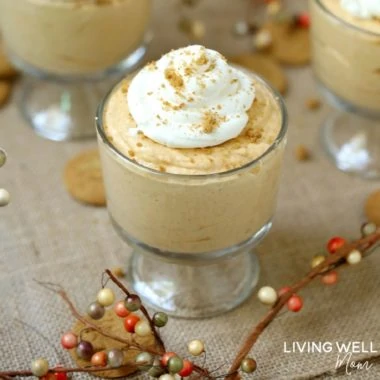 pumpkin spice mousse with whipped cream in glass bowls
